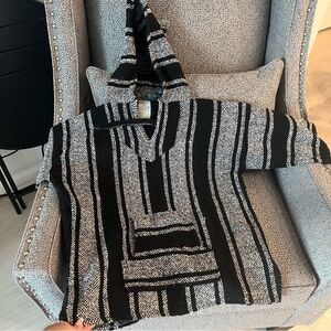 Black and white knit sweater with hoodie